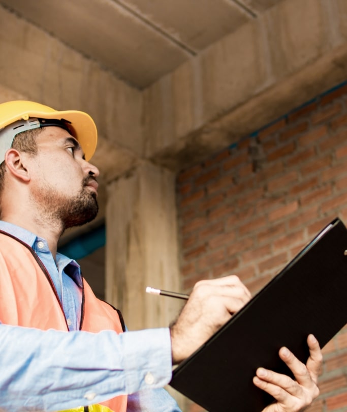 appraiser inspecting inside a brick walled building